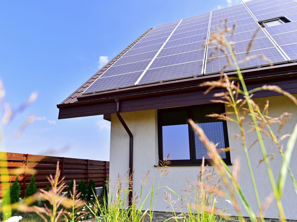 Renewable energy house with solar and thermal photovoltaic panels on roof